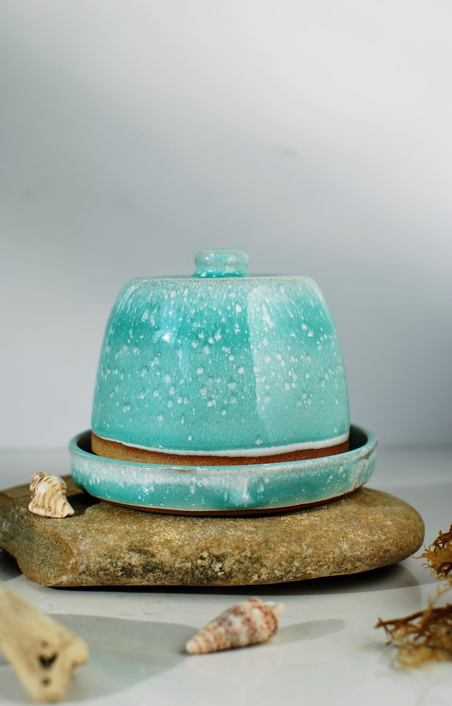 Full butter dish, front view: Handmade ceramic butter dish in turquoise speckled glaze from the Maguelone collection by Studio Lippi Ceramics, Dublin, Ireland.